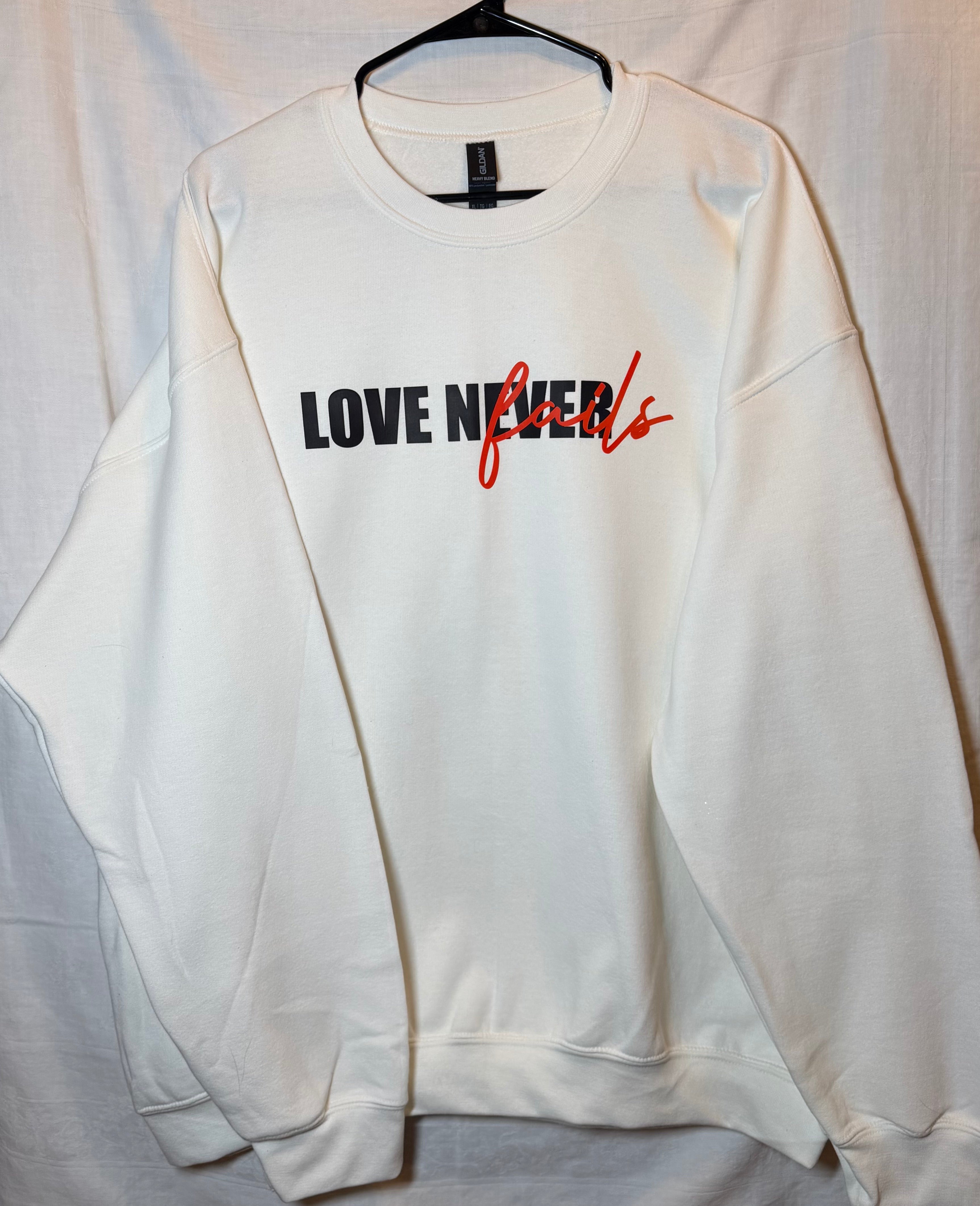 “Love Never Fails” Statement Sweatshirt | White