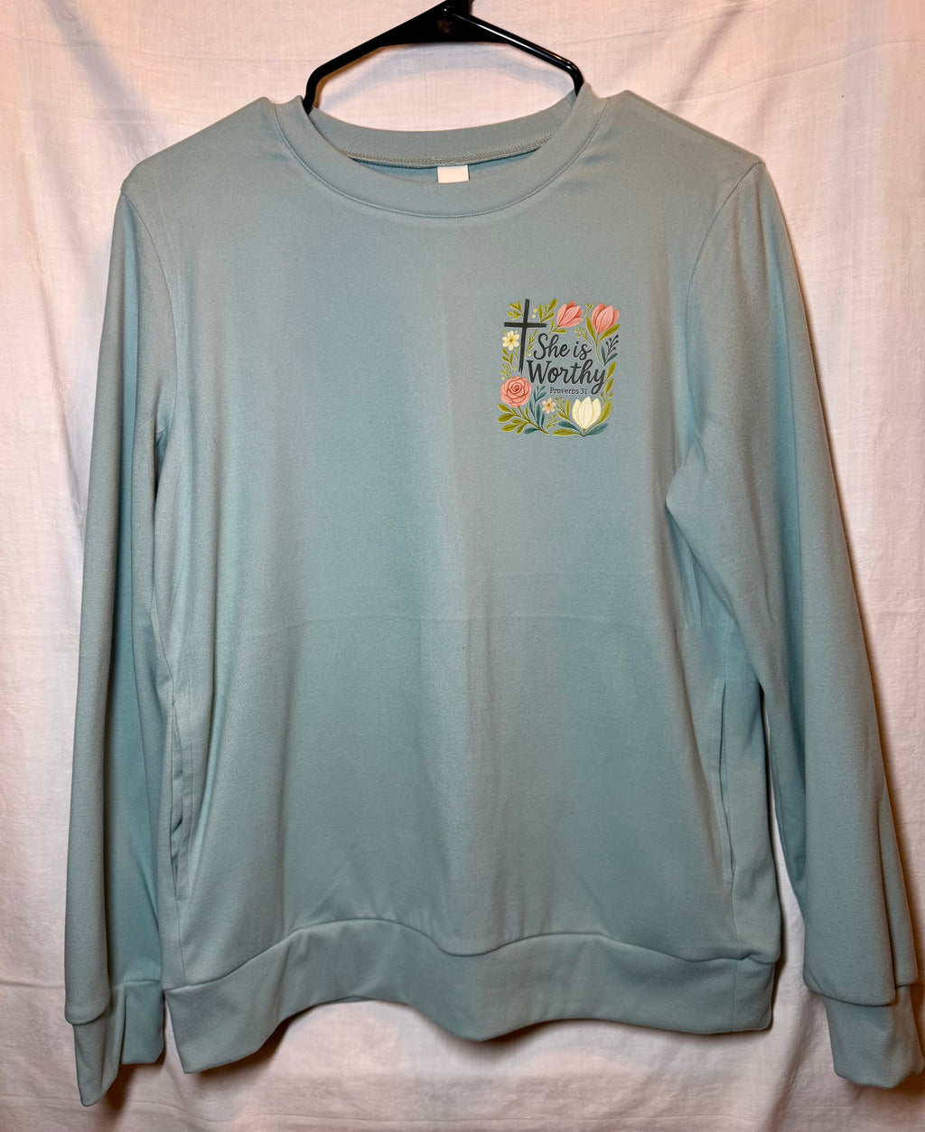 “She Is Worthy” Soft Blue Sweatshirt | Floral Cross Graphic